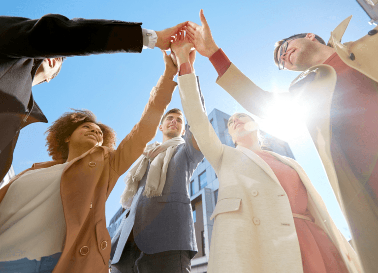 Friends joining hands