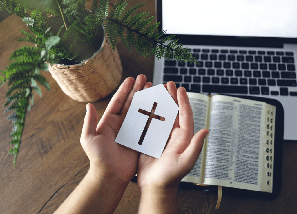 Holding cross bible
