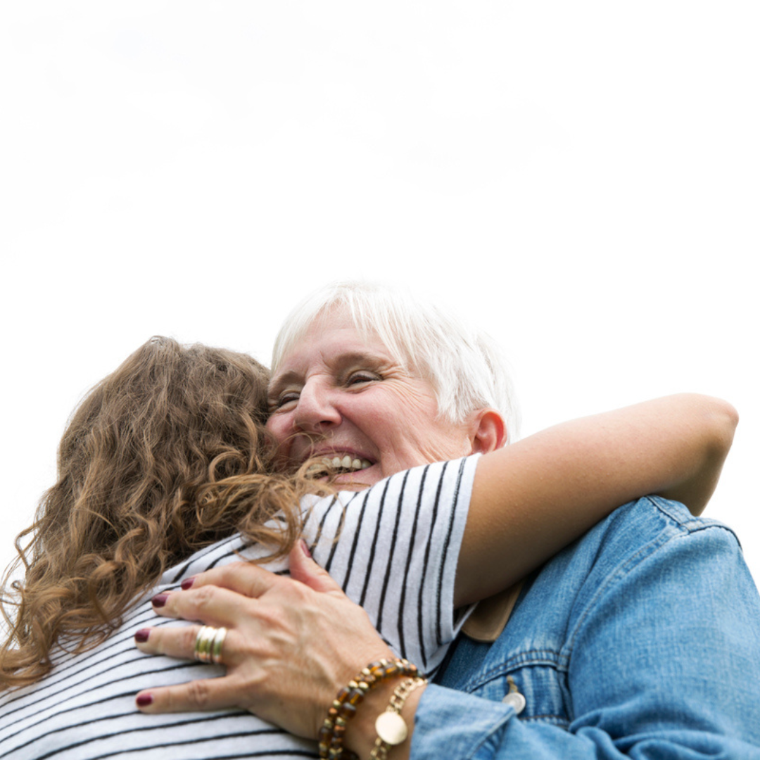 Happy Women Hugging